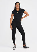 Black Lucy Short Sleeve Shaping Bodysuit - Styled with Black Leggings | Yummie